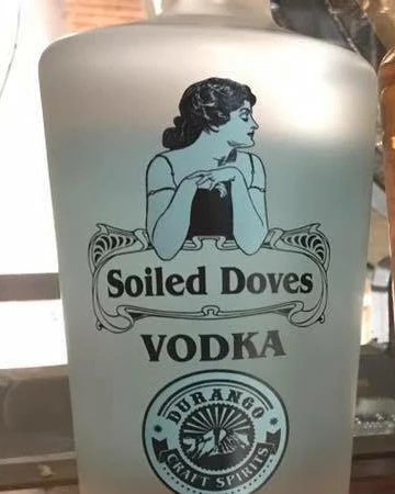 Soiled Doves Vodka bottle label with an Art Nouveau portrait of a lady of the night